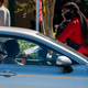 A voter cast his ballot at a drive-through vote by mail ballot box at the Alafaya Branch Library in Orlando, Florida, on October 30, 2020.